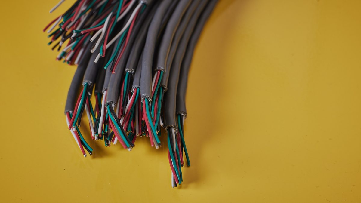 An image of cables set over a yellow backdrop